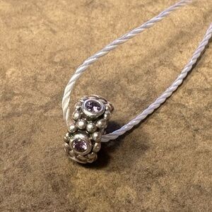 Pandora .925 Sterling Silver and Amethyst spacer charm for moments brace…
